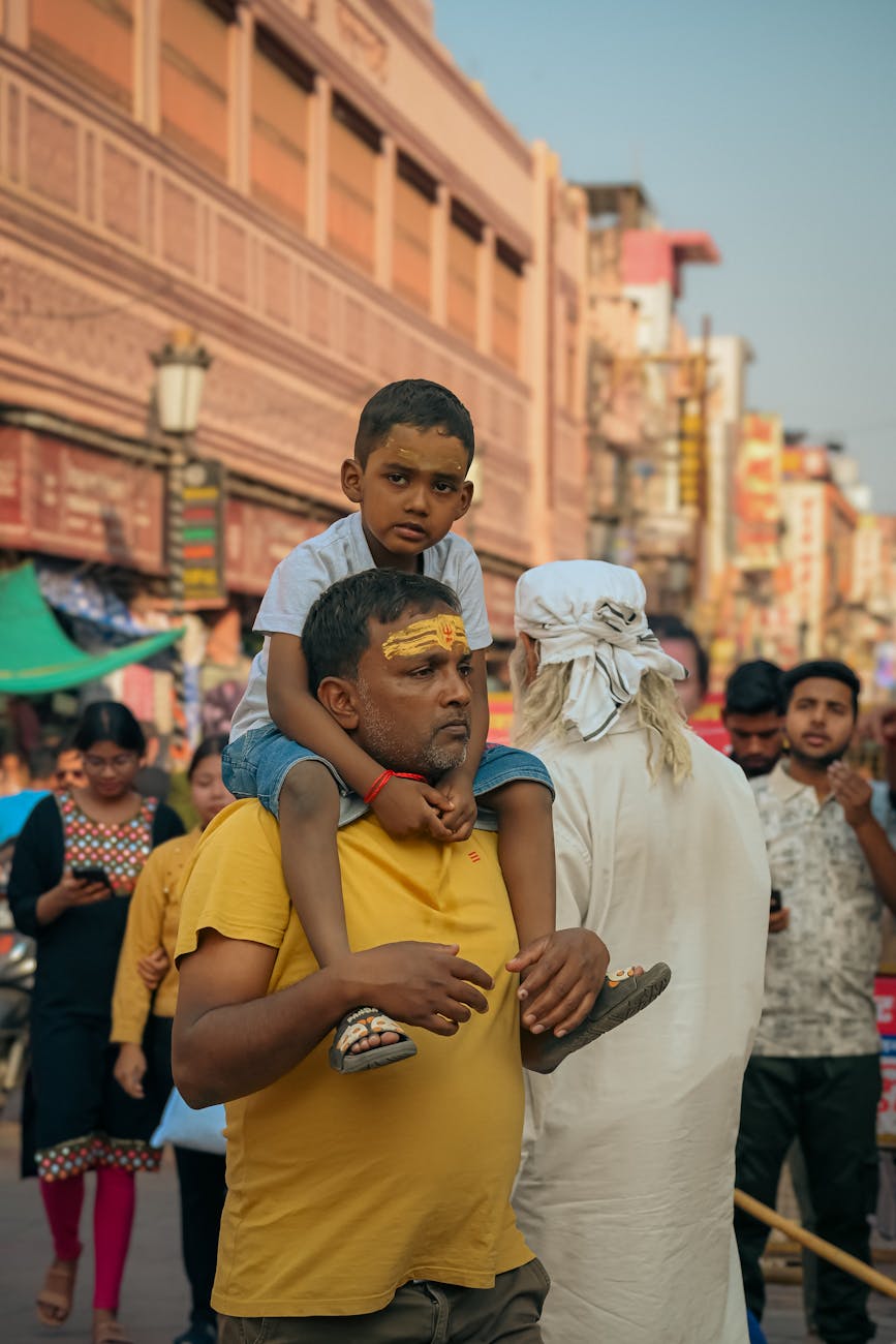 father and son in varanasi street market