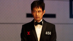 SQUID GAME S3 ENDING EXPLAINED: Gi-hun's final, heartbreaking sacrifice on the Sky Squid Game pillar. Who inherits the prize? The chilling Cate Blanchett cameo and the game's brutal, capitalist legacy revealed.