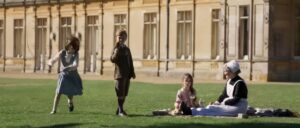 The kids play together in the background of the movie.